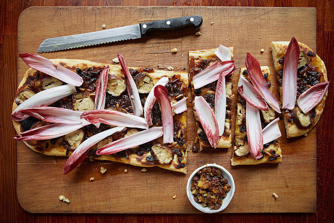 A goats cheese, red onion and chickory topped flat bread