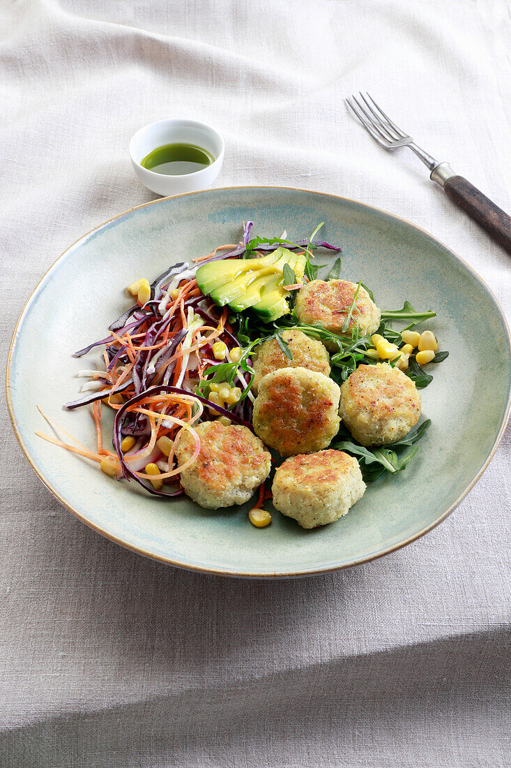 Cod meatballs served with cabbage salad
