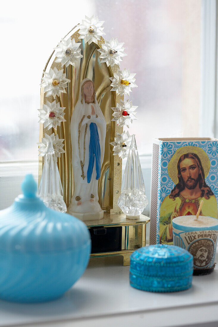 Religious ornaments on windowsill of 20th century Stockholm apartment