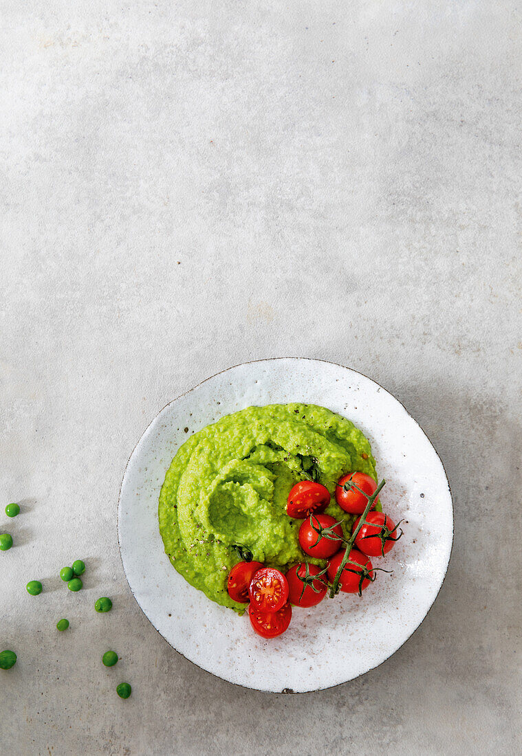 Pea puree with cocktail tomatoes