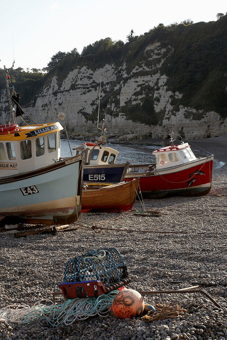 Fishing boats and lobster pot on Devon beach