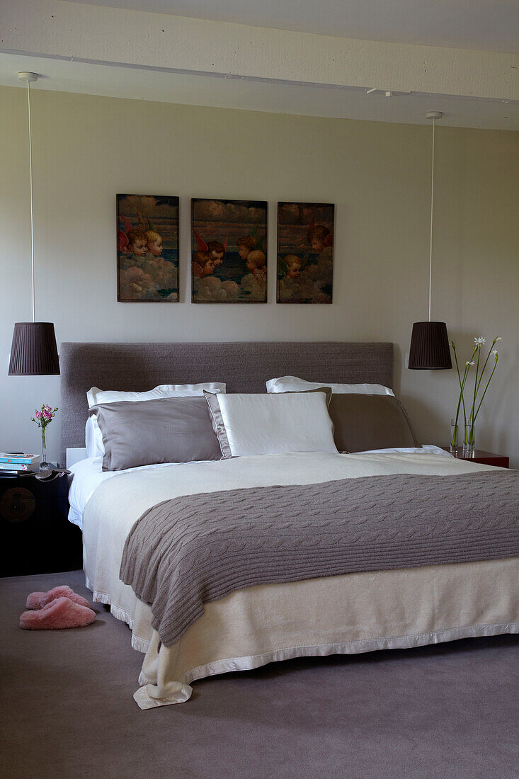 Soft furnishings in silk in bedroom with triptych