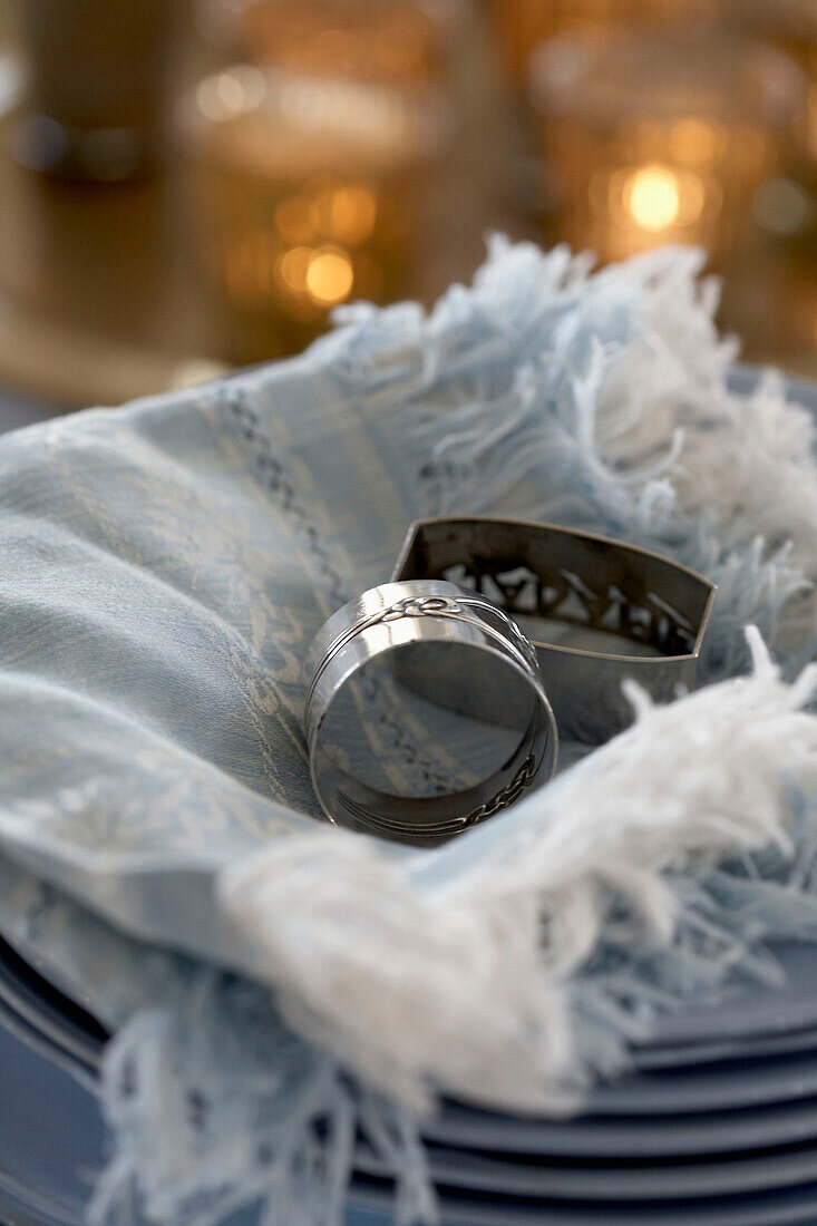 Close-up of napkin rings on napkin