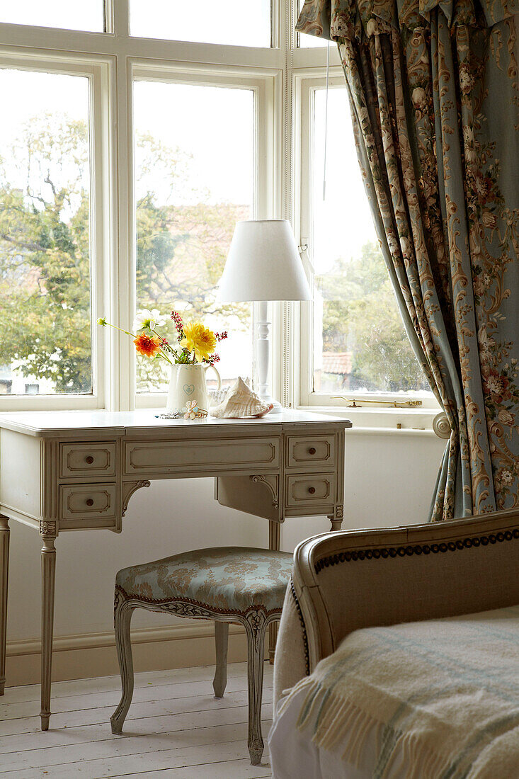 Dressing table at bedroom window of Norfolk beach house, UK