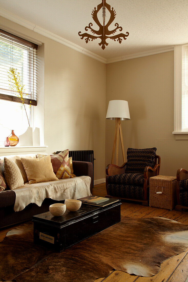 Seating area in corner of living room in Brighton home, East Sussex, England, UK