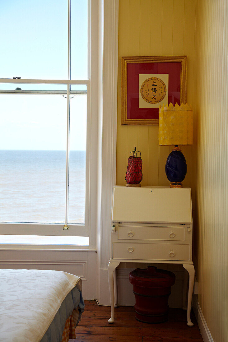 Sash window and writing desk in Cromer beach house, Norfolk, England, UK