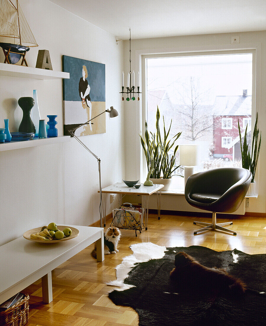 Leather armchair in front of window facing coffee table