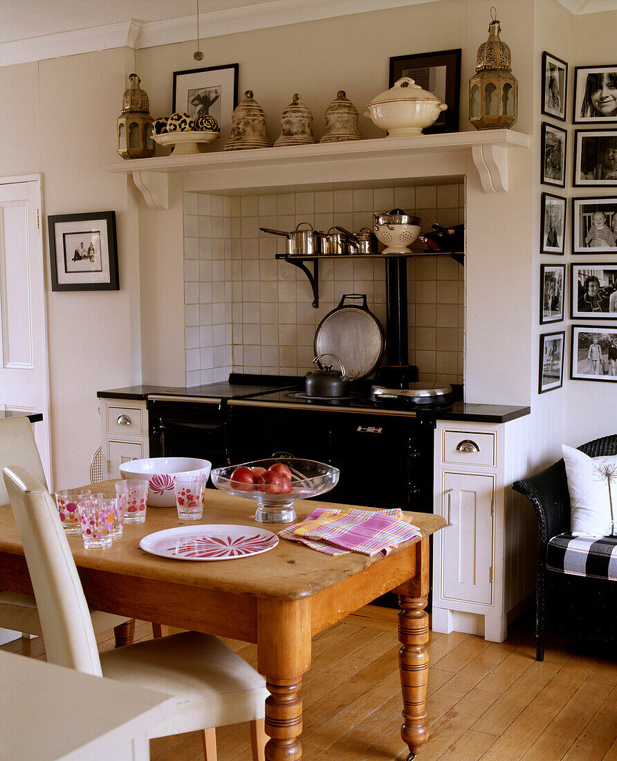 View of a traditional kitchen dining area with large wooden table