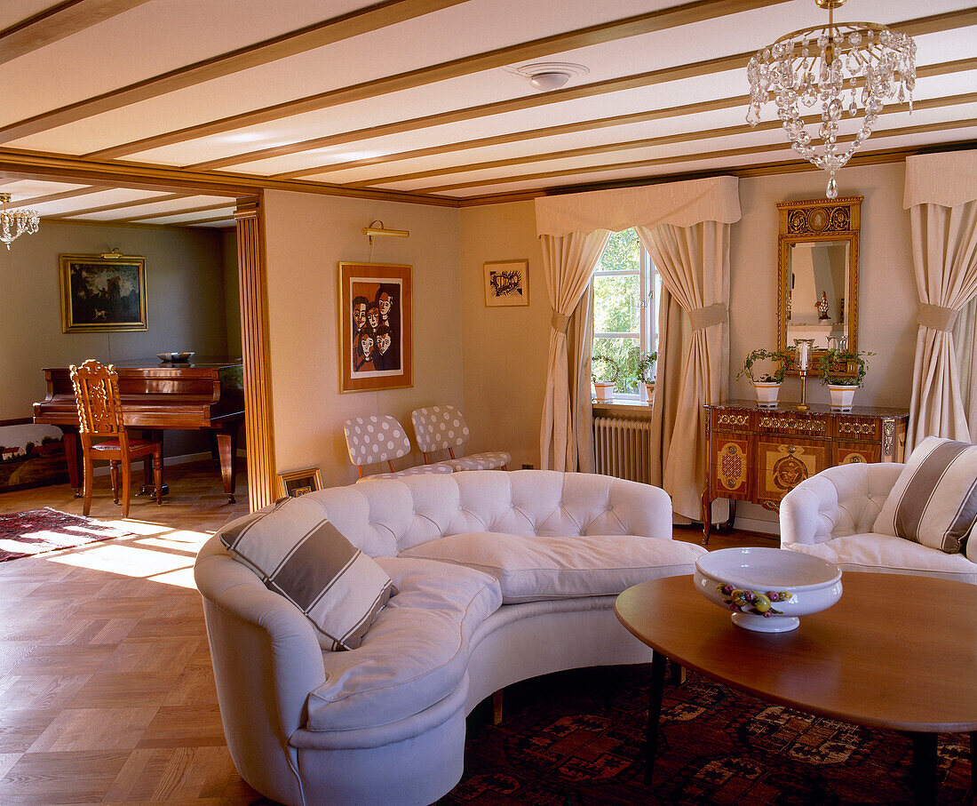 Open plan sitting room with sofas and coffee table in Mjolby, Sweden