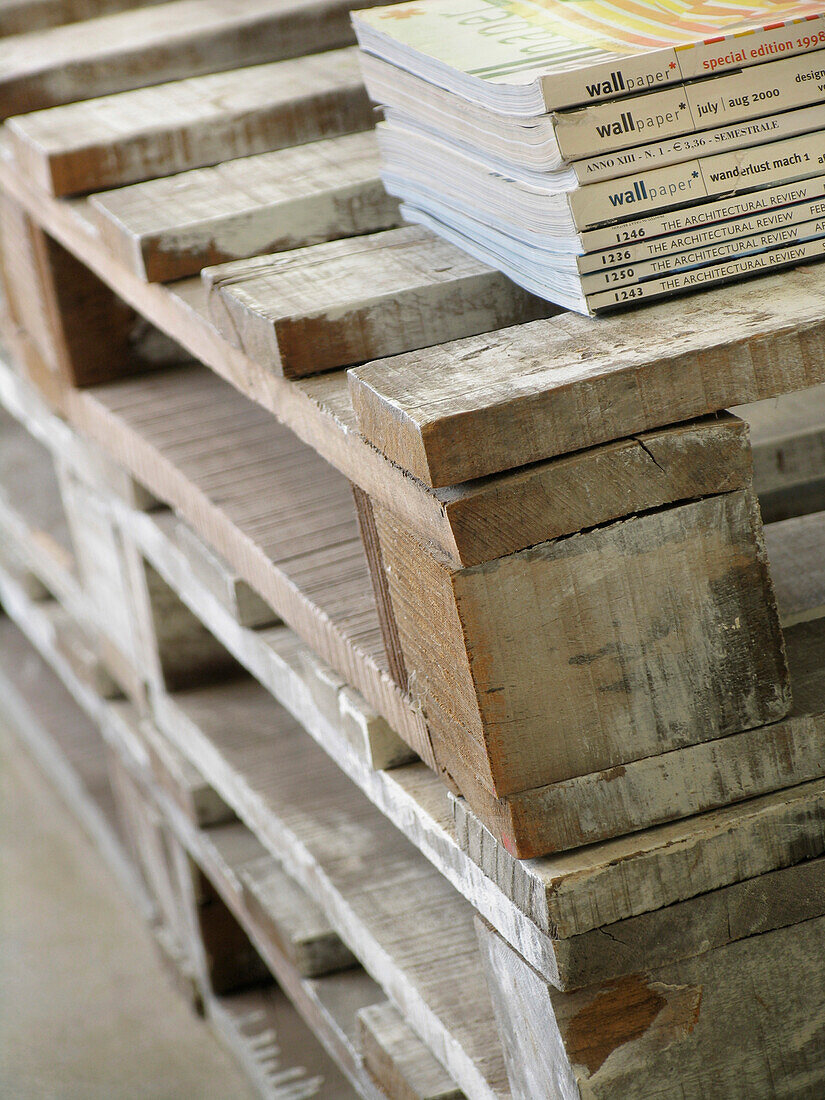 Detail of staked wooden palettes used as a coffee table