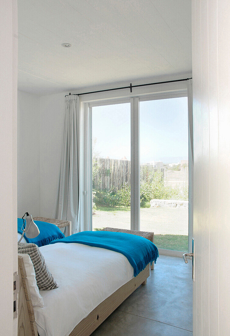 ChildrenØµs bedroom with wicker beds and blackout curtains