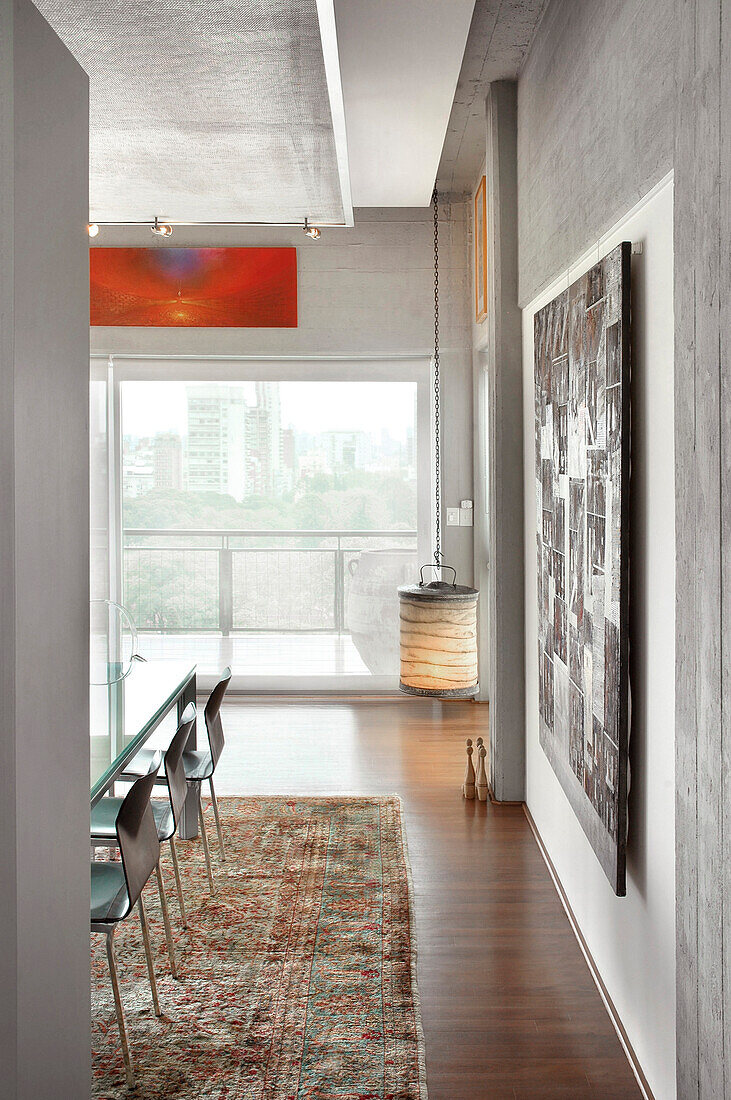 Dining room with modern art and city view