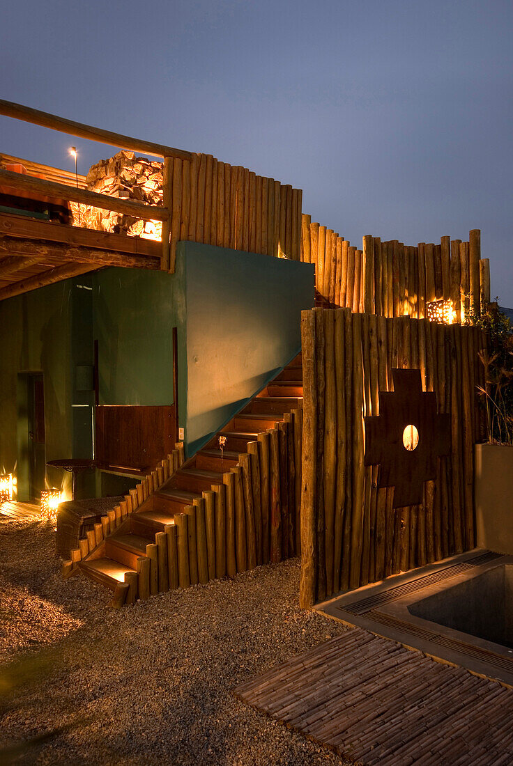 Gallery with roofed exterior dining room and recycled furniture