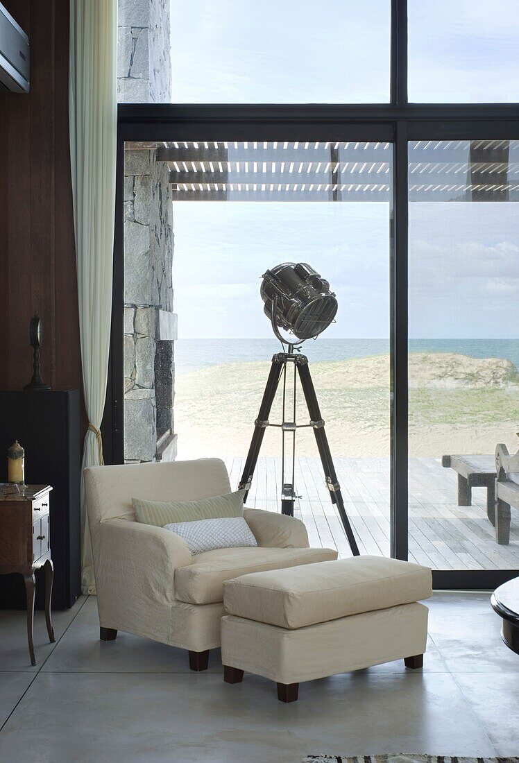 Uruguay home interior with armchair and tripod