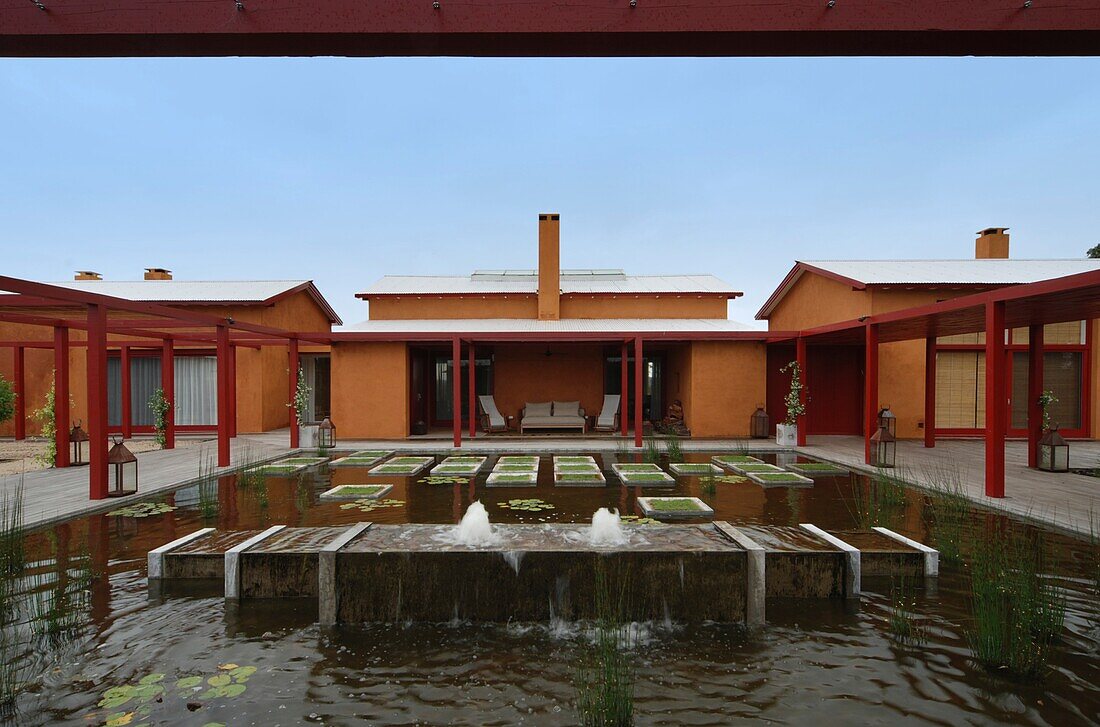 Uruguay, exterior of house with fountain in foreground