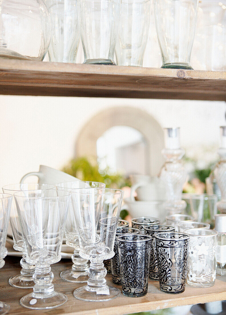 Selection of glassware on wooden shelf