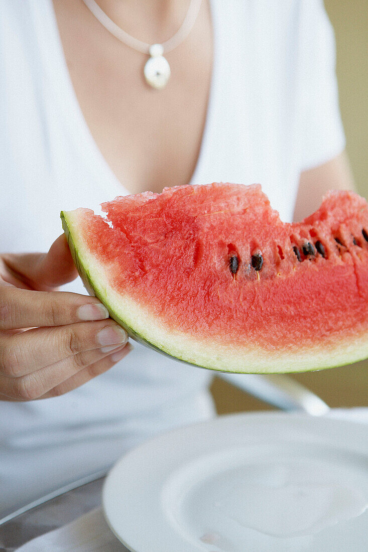 Woman holding watermelon