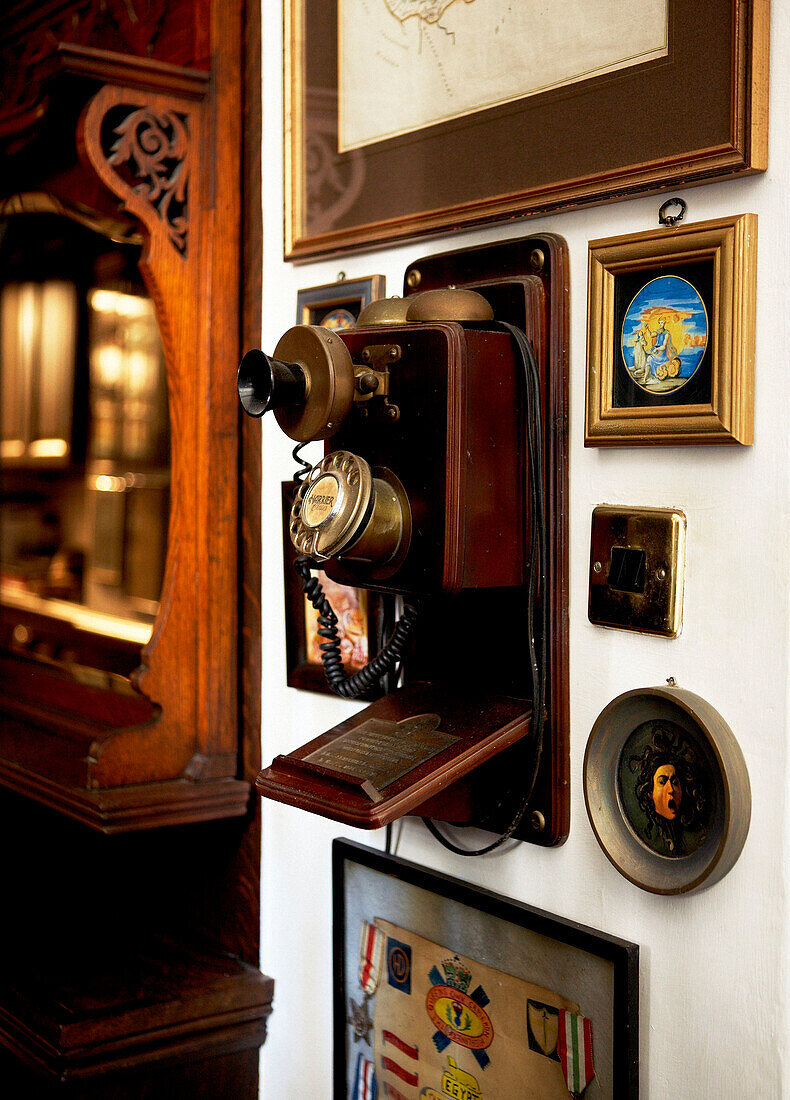 Reproduction GPO wall telephone in hallway of Grade I listed Elizabethan manor house in Kent 