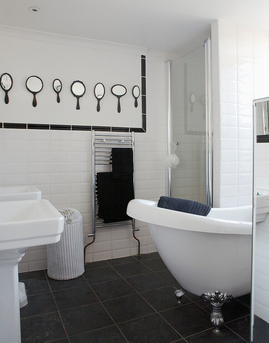 Display mirrors in white tiled 18th Century Georgian bathroom Hampstead, London