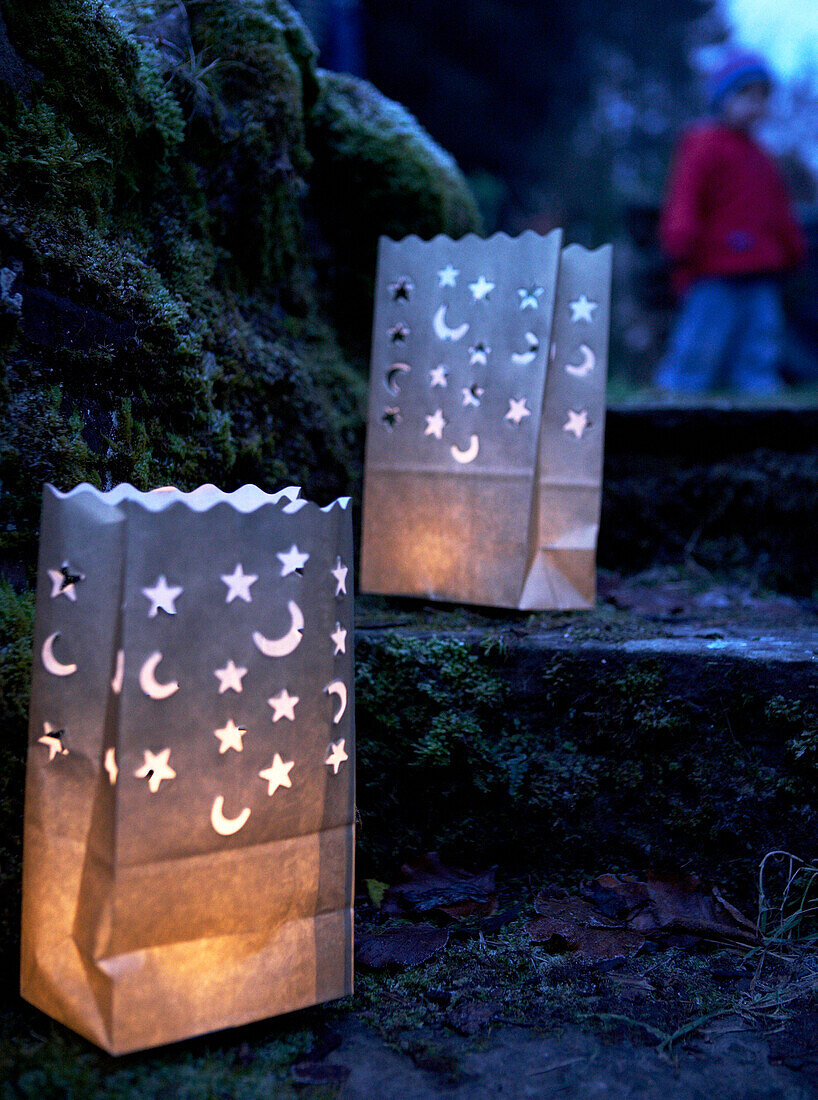 Lit lanterns on steps of 16th Century Welsh farmhouse