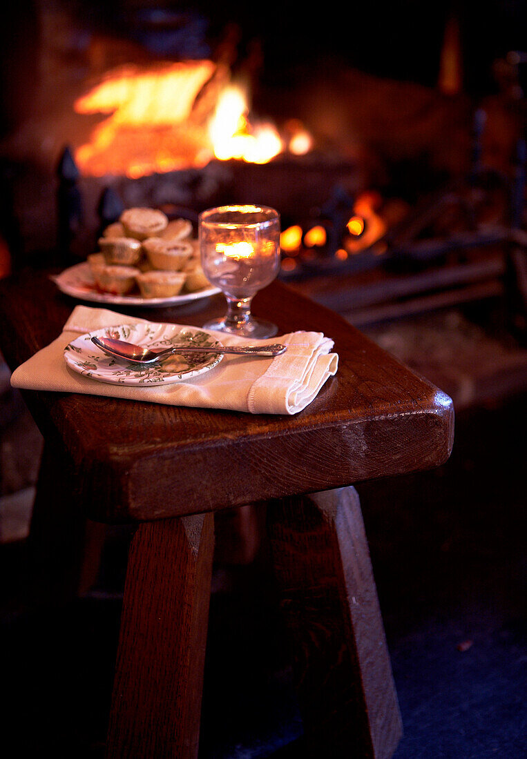 Mince pies on stool at fireside