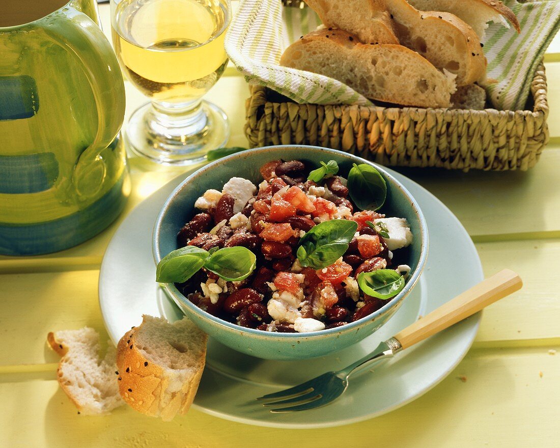 Red bean salad with tomatoes & sheep's cheese in bowl