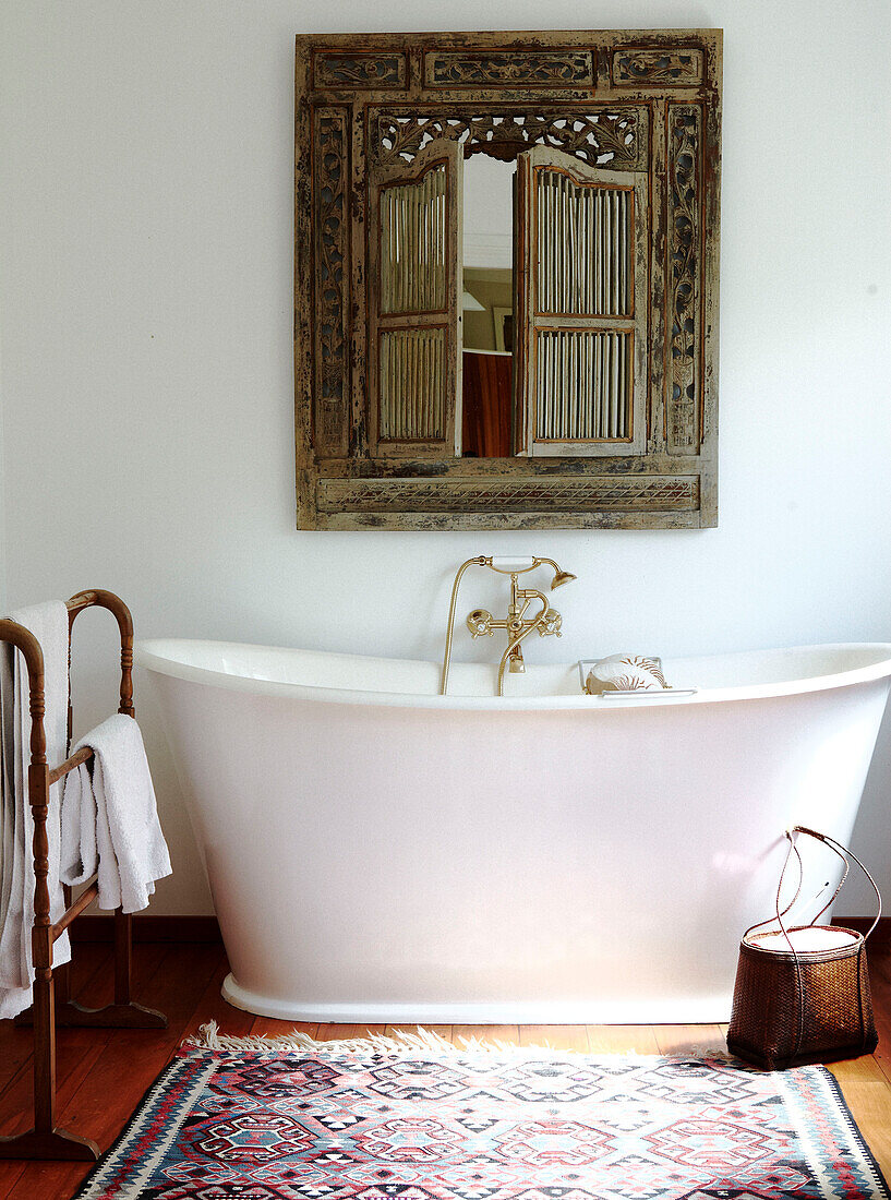 Freestanding bath below salvaged mirror Masterton New Zealand