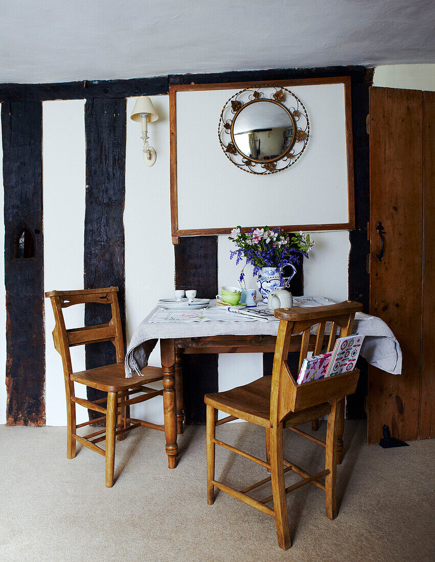 Table and chairs in timber framed Devon cottage