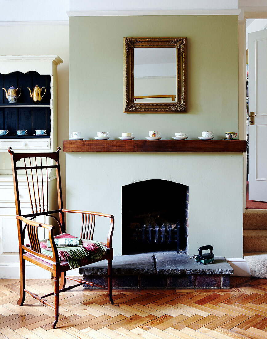 Seating area with artwork and black fireplace