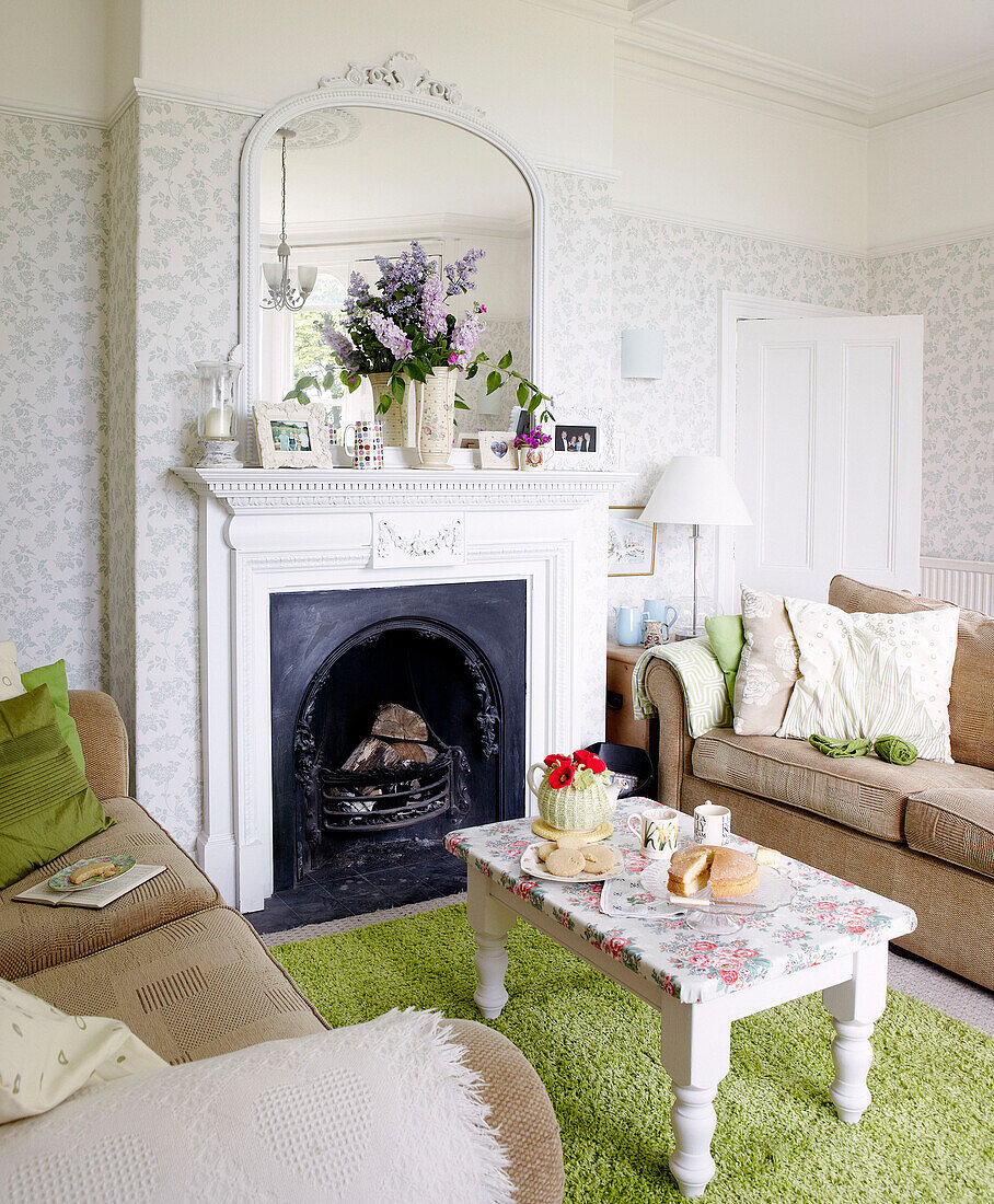 Afternoon tea set in front of living room fireplace