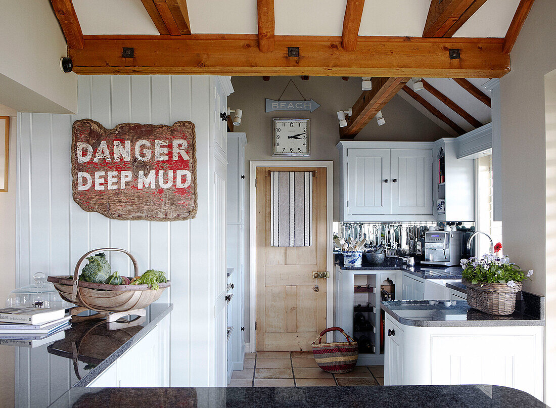 Danger Deep Mud' sign in kitchen of Hampshire home England UK
