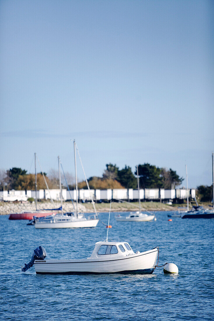 Fishing boats moored off shore Cirencester Gloucestershire England UK