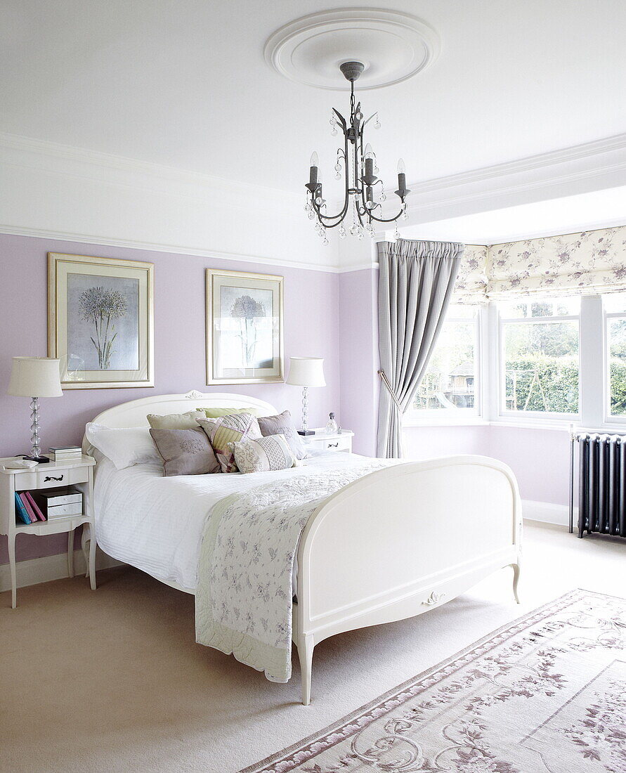 White double bed in lilac bedroom of Harrogate home Yorkshire England UK