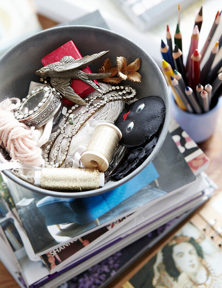 Bowl of craft objects with colouring pencils in Hastings home, East Sussex, UK