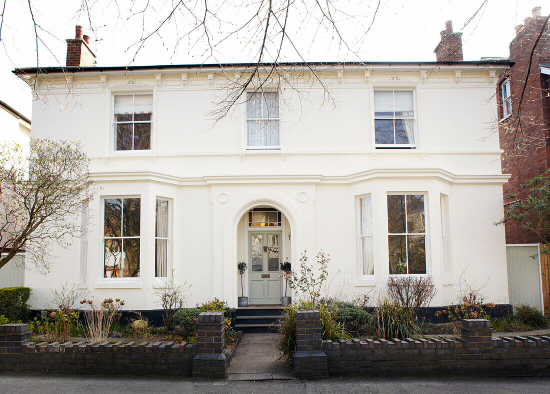 Arched porch of detached Warwickshire house, England, UK