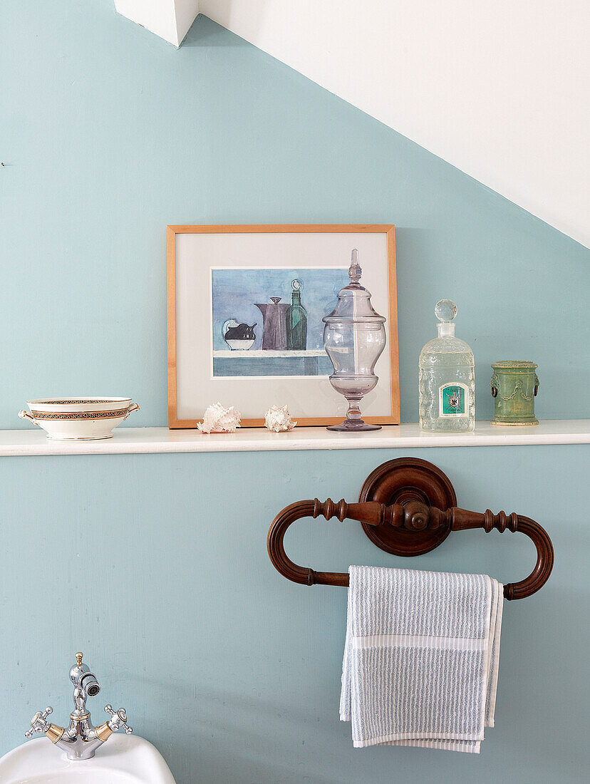 Ornaments on bathroom shelf in traditional country house Welsh borders UK