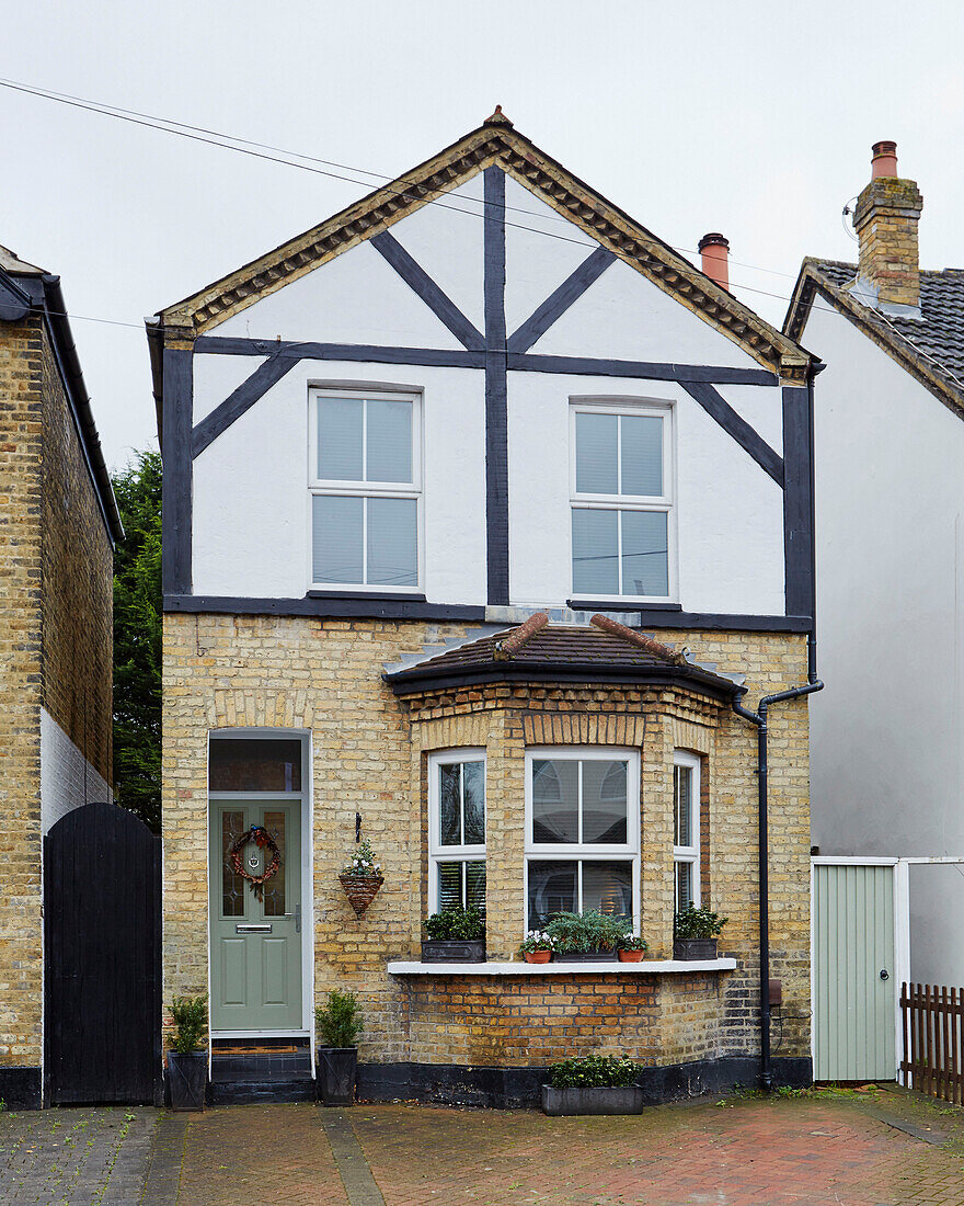 Half-timbered facade of detached Kent home England UK