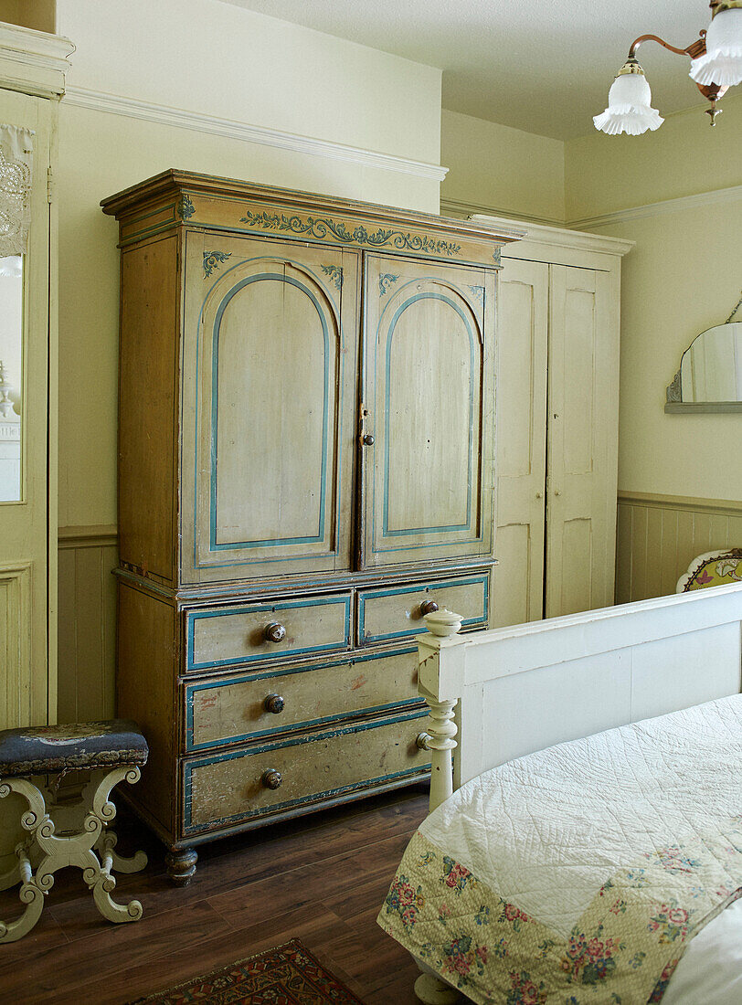 Vintage wardrobe and stool with footboard in Whitley Bay cottage Tyne and Wear England UK