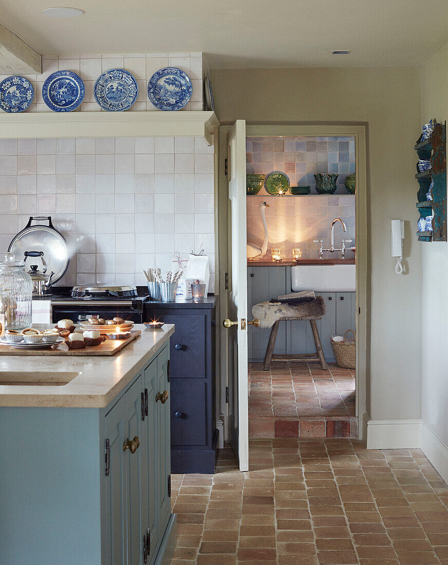 Mince pies on island unit in kitchen with terracotta tiled floor Oxfordshire home England UK