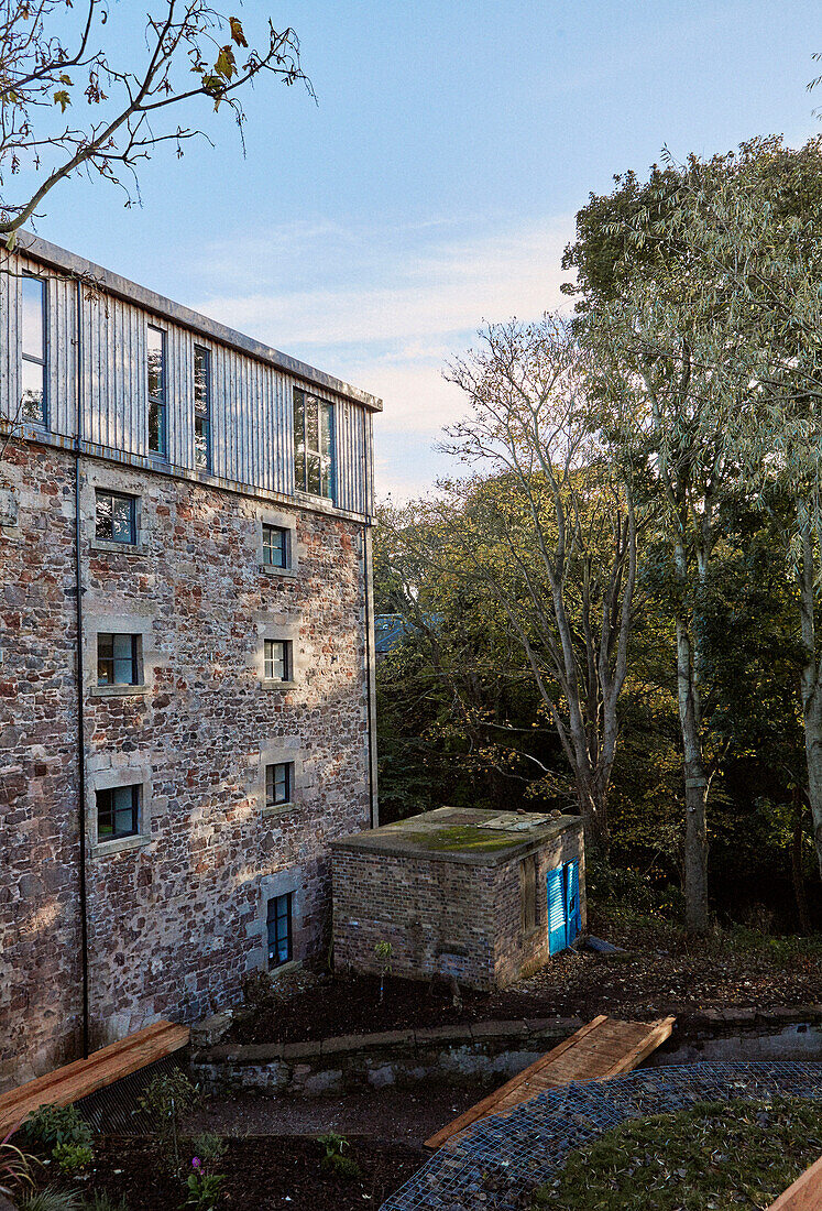 Exterior of 19th Century Grain Mill in the Scottish Borders garden under development Scotland UK