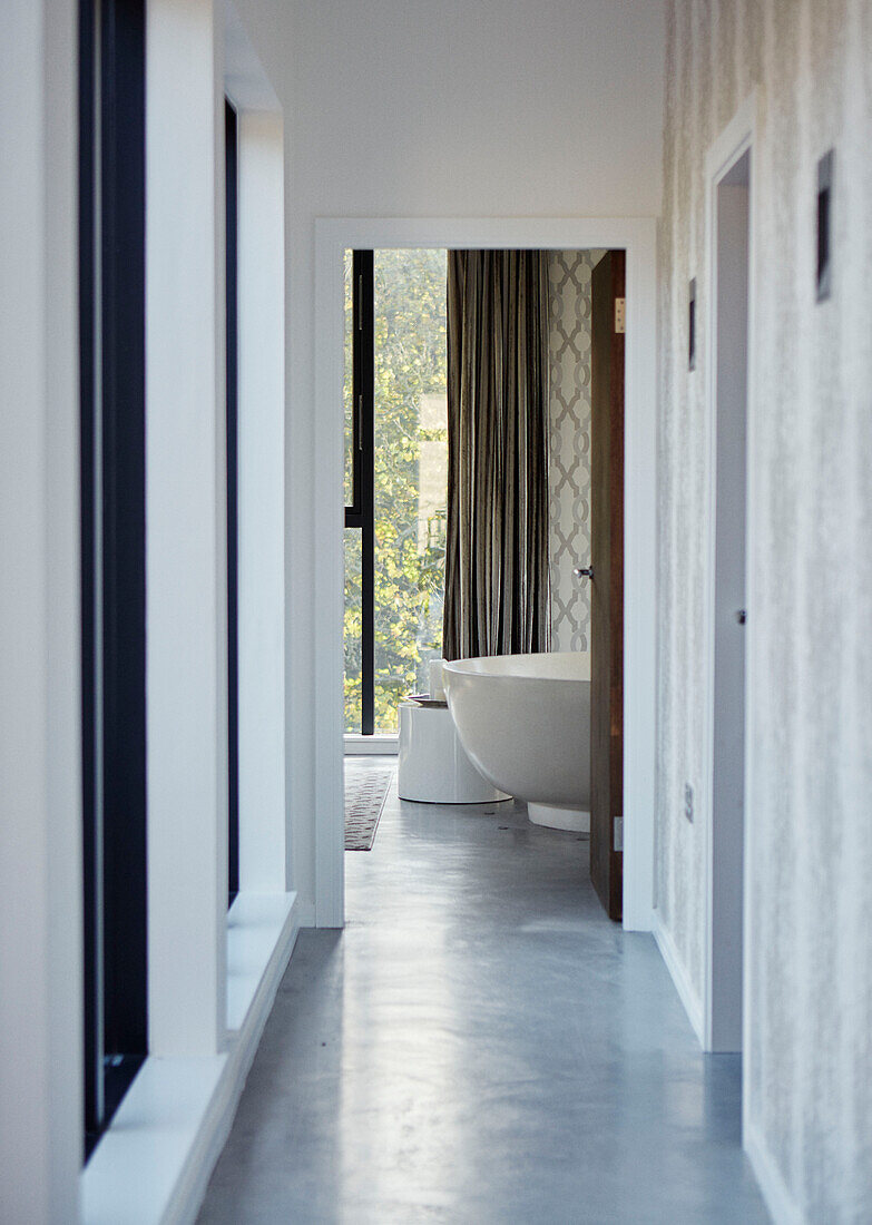 View through hallway to bathroom in 19th Century Grain Mill conversion Scottish Borders, UK