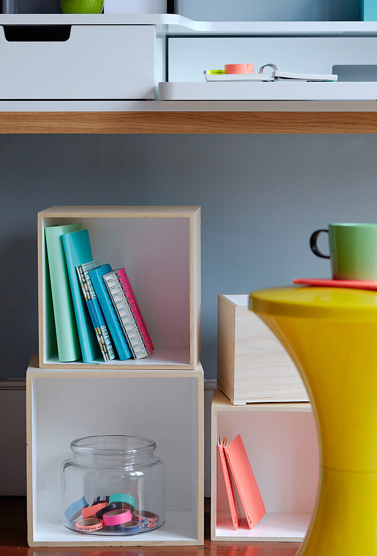 Notebooks in cube desk storage, UK work studio