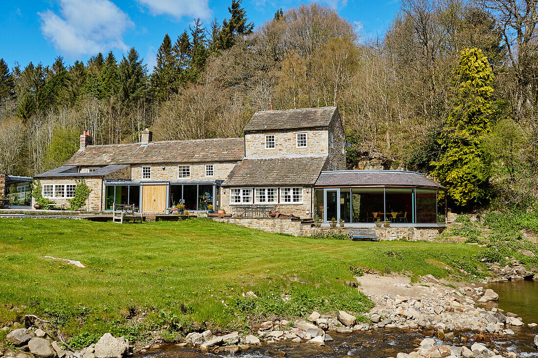 Renovated 18th century Northumbrian mill house in woodland, UK