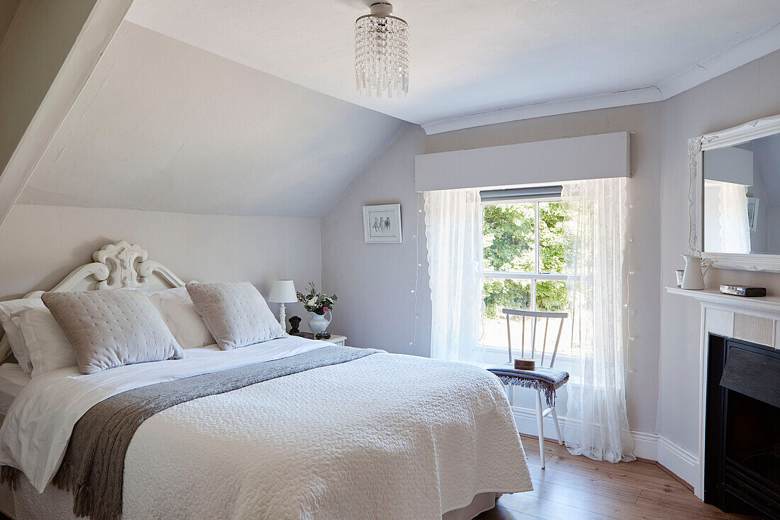 Light grey furnished attic bedroom in Northumberland cottage, Tyne and Wear, England, UK