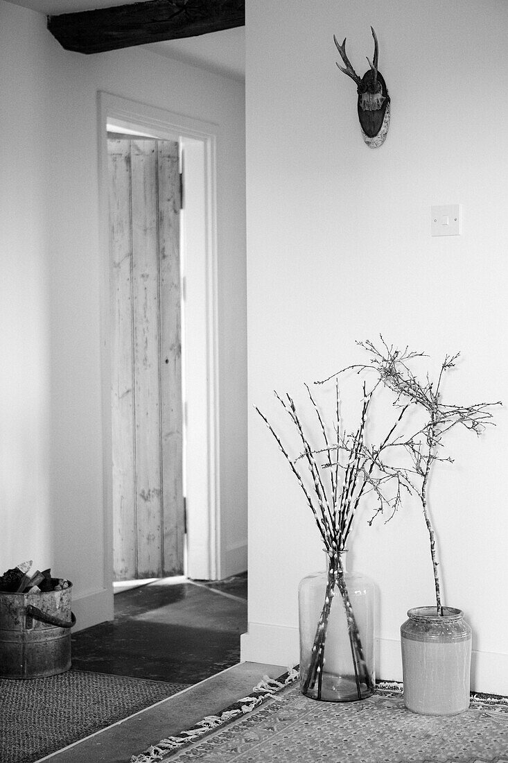 Twig arrangement in porch entrance of Warwickshire farmhouse, England, UK