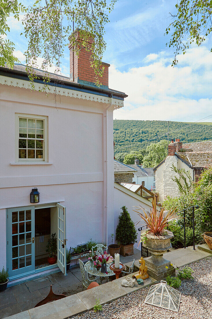 Elevated view of open back door and patio of 19th century Georgian townhouse in Talgarth, Mid Wales, UK