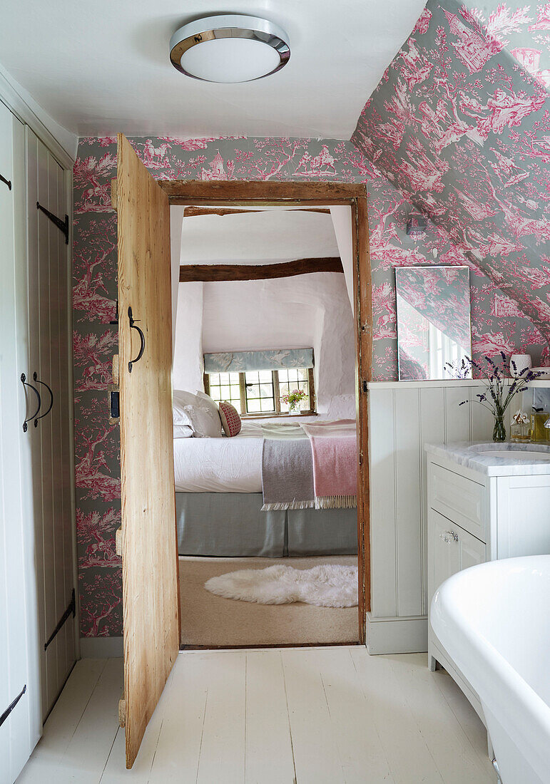 View through open bedroom doorway from ensuite in Berkshire cottage, England, UK