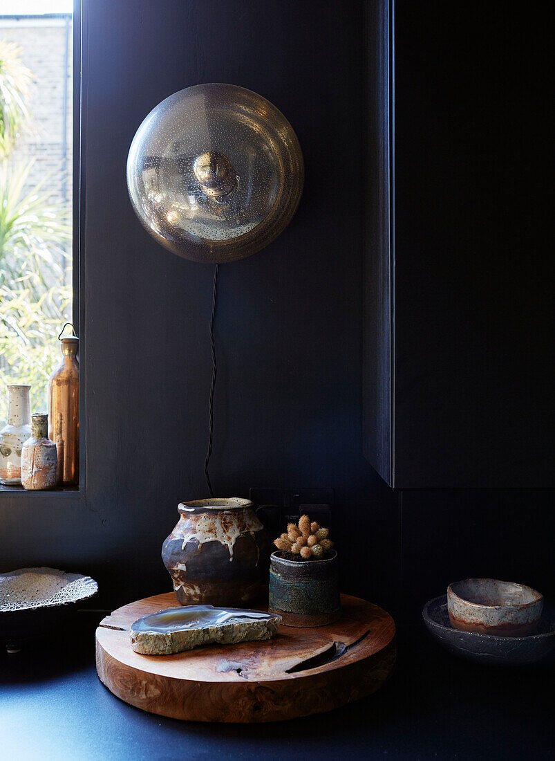 Vintage light and ceramic pots with wooden chopping board in Ramsgate kitchen Kent, UK