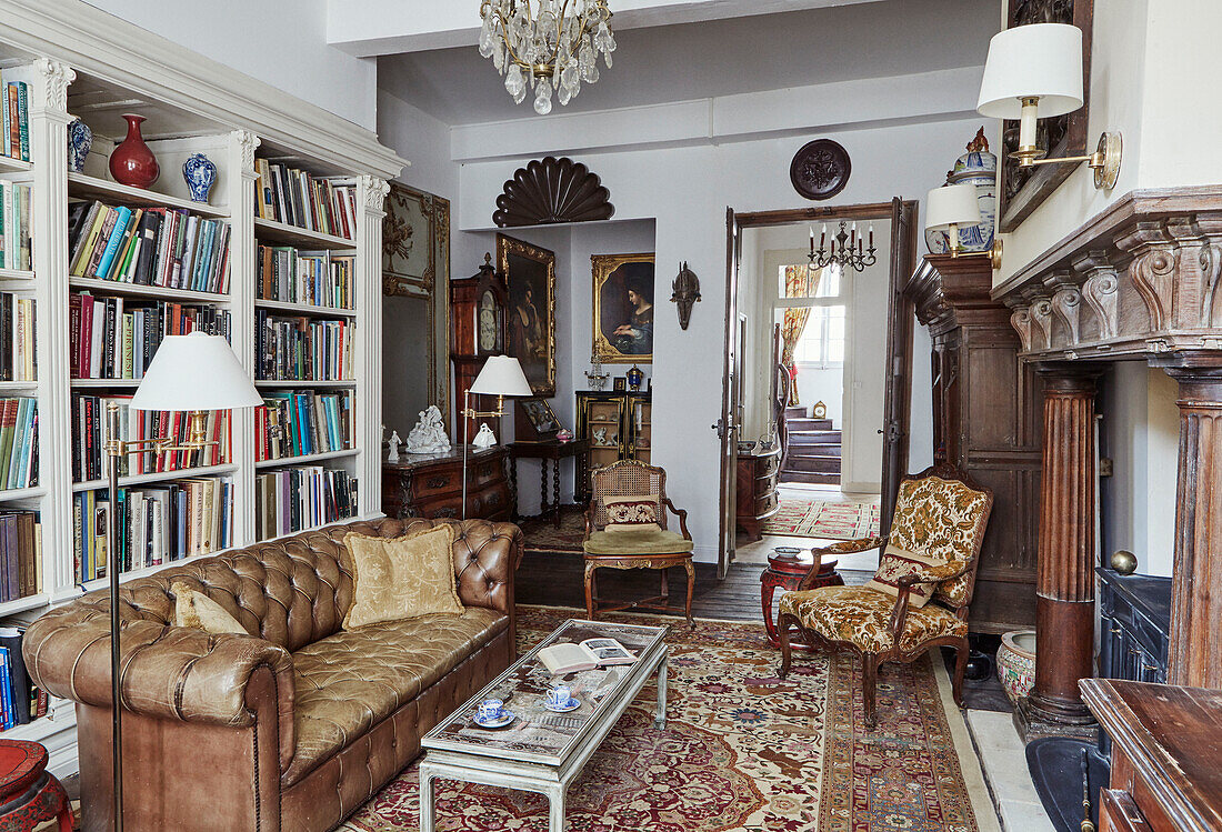 Vintage furniture and bookshelves in Foix townhouse Ariege, France