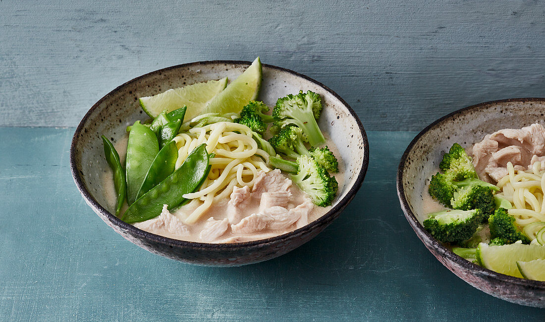 Exotic Thai ramen with chicken and green vegetables